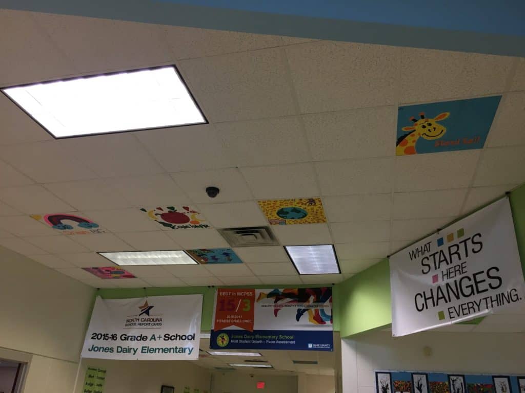 Decorated ceiling tiles adorn the school hallways after this school fundraiser