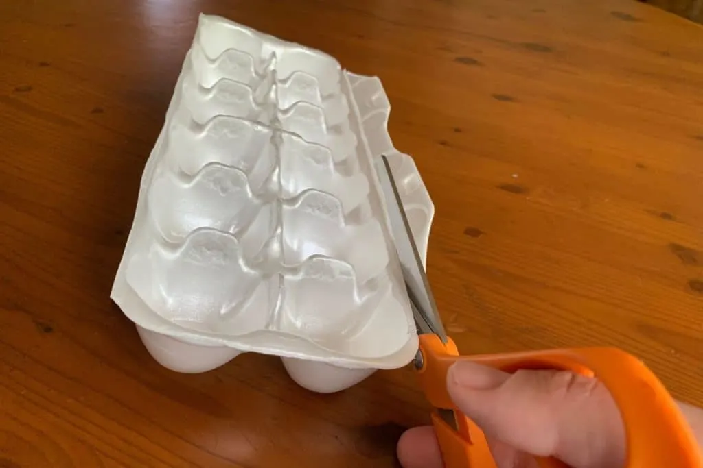 cutting off the locking tab of the egg crate