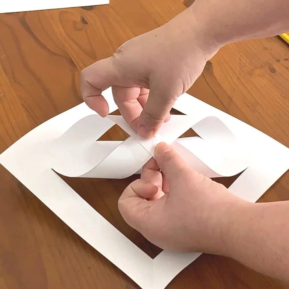 folding the second layer of paper for a giant 3d snowflake