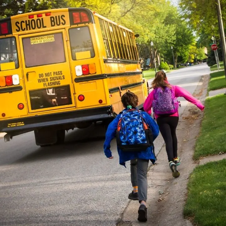 Kids headed to the bus for year round school