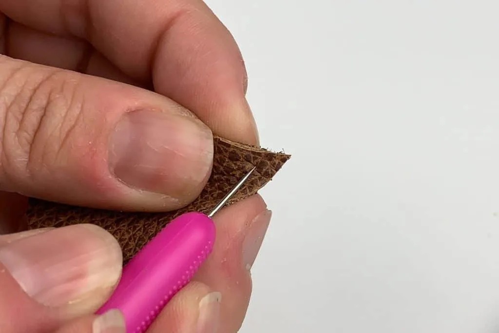 Punching a hole in the leather