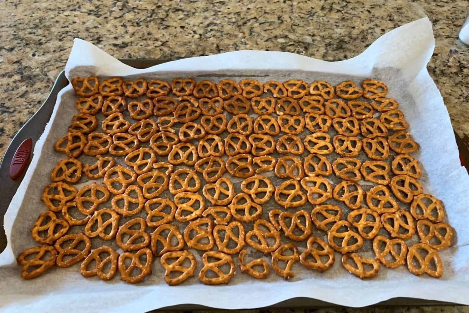 pretzels laid out on a parchment lined cookie sheet for christmas crack