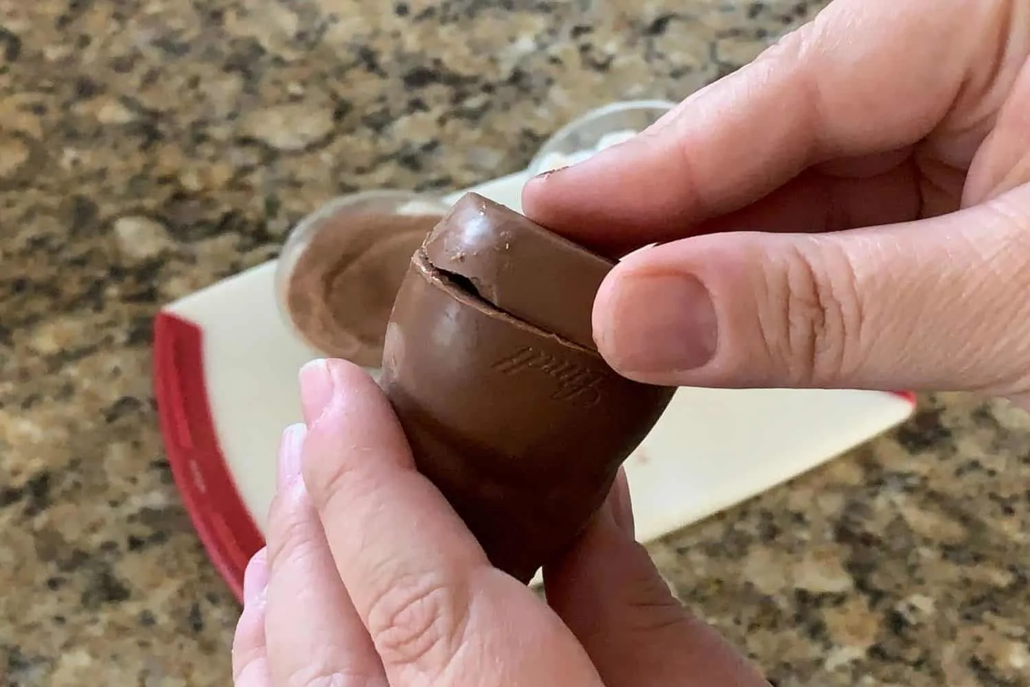 Reattaching the bottom of the chocolate snowman