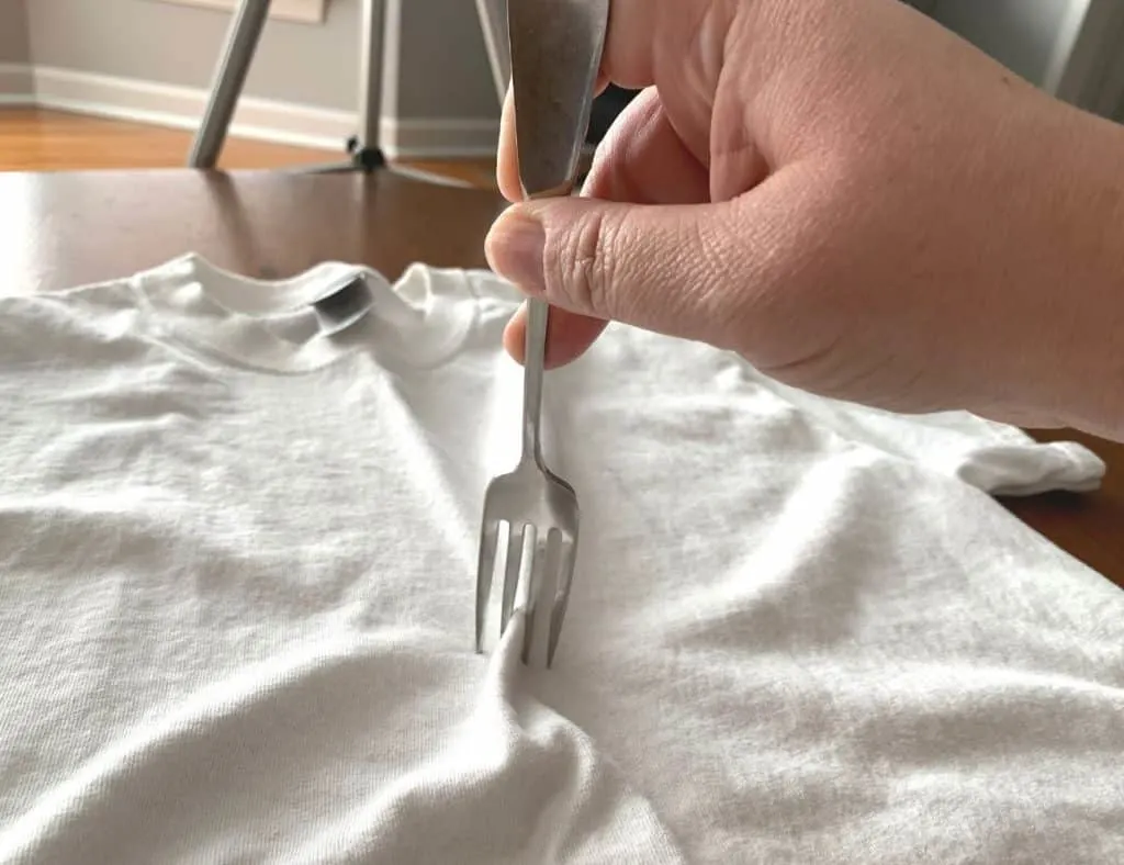Using a fork to start the twirl of the t-shirt