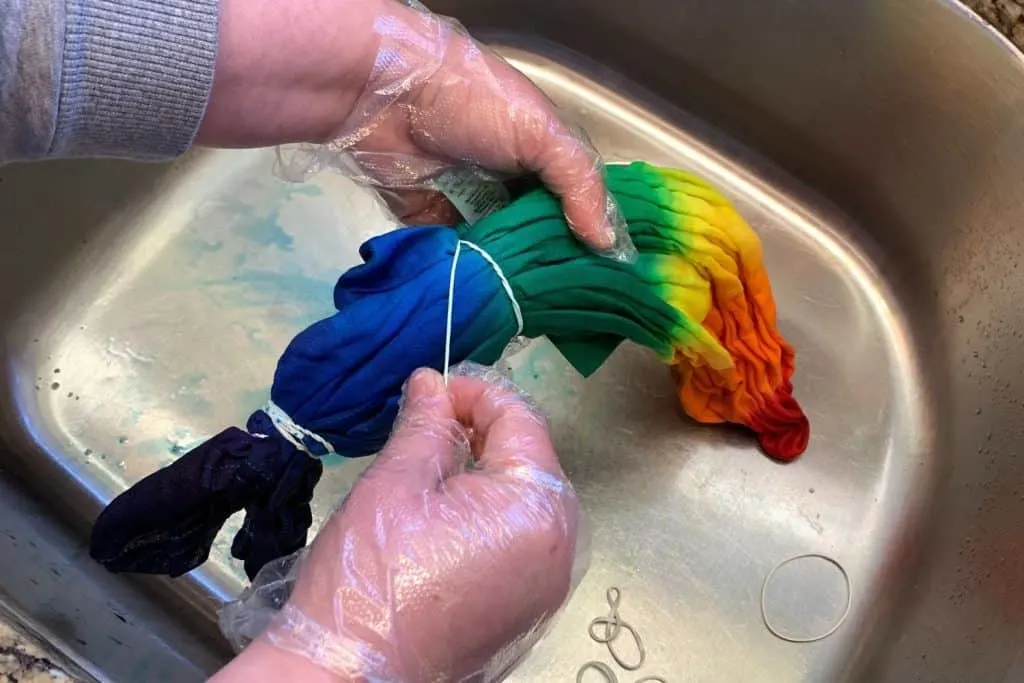 Taking the rubber bands off the tie dye bullseye design