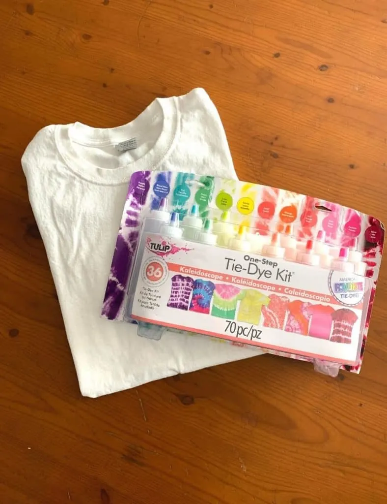 Supplies for tie dye bullseye project: a white t-shirt and a tie dye kit