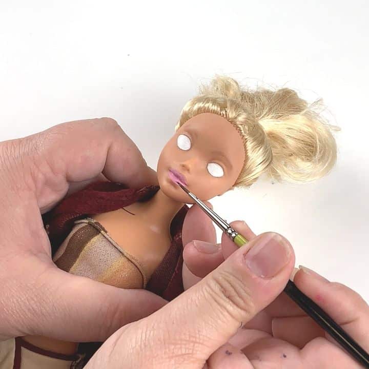 repainting lip on a doll
