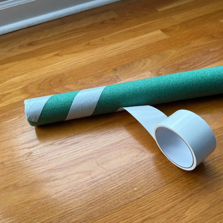 Wrapping duct tape around a pool noodle