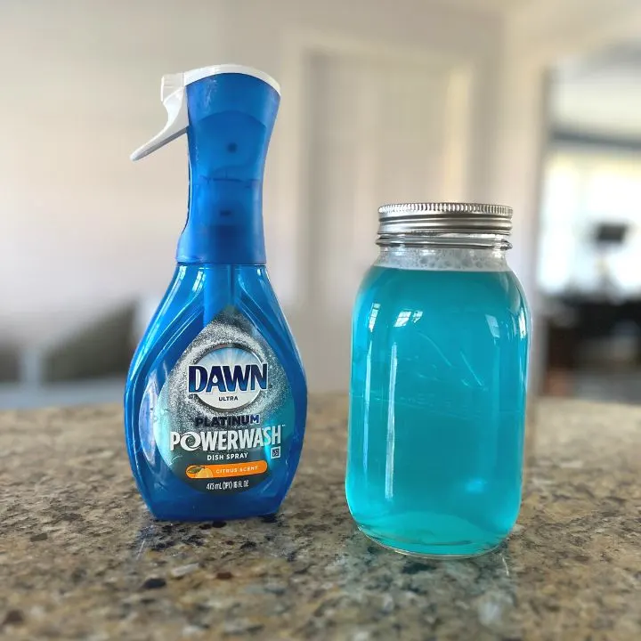 DIY Dawn Powerwash in a mason jar next to an original bottle