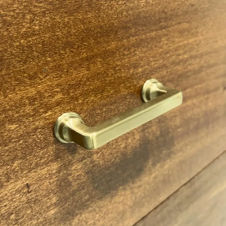 a champagne bronze drawer pull