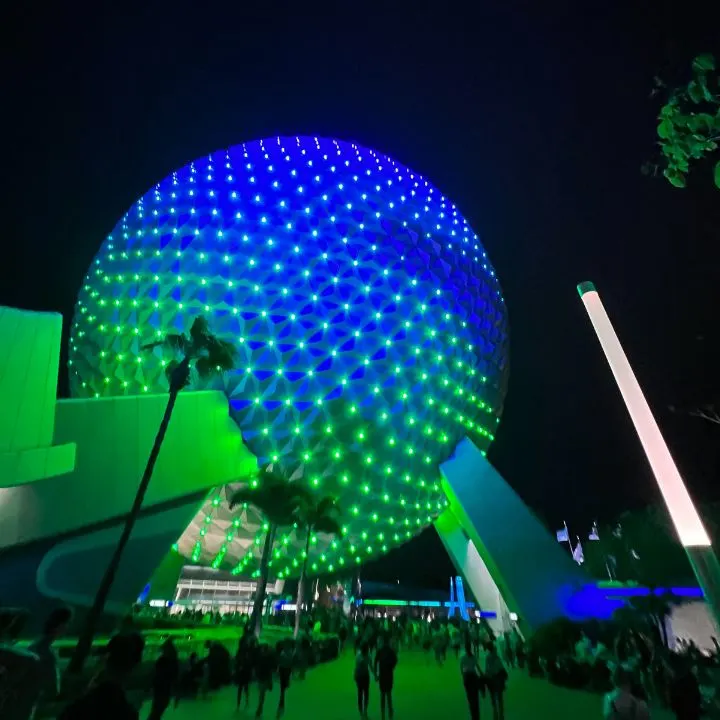 Spaceship Earth ride at Disney World lit up for night time