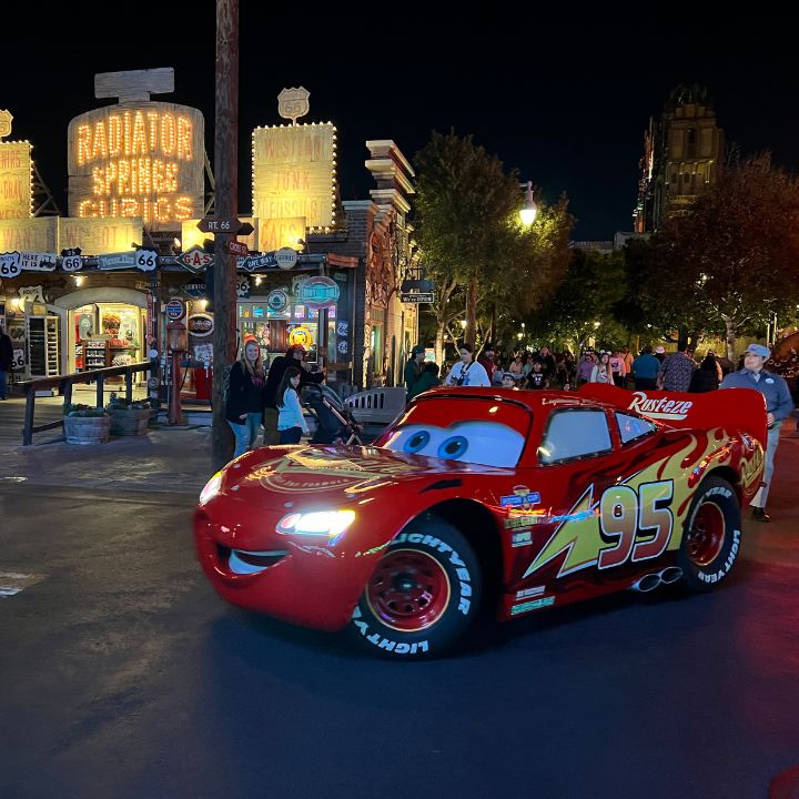 Lightning McQueen driving through Radiator Springs at Disney's California Adventure Park